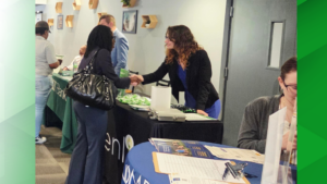 Small Business Specialist shakes hand with small business owner