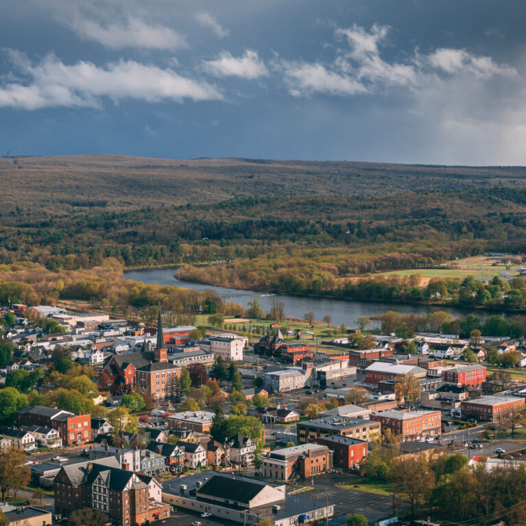 A city with a river running through it, – view of Port Jervis, New York from Elks-Brox Memorial Park A city with a river running through it, - view of Port Jervis, New York from Elks-Brox Memorial Park
